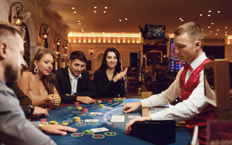 guests playing poker at casino table