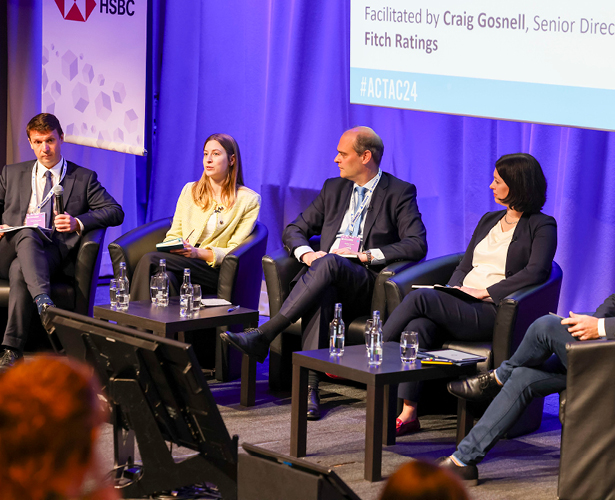 Speakers on stage discussing ESG at the ACT Annual Conference