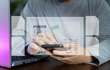 Man using mobile phone to e-invoice